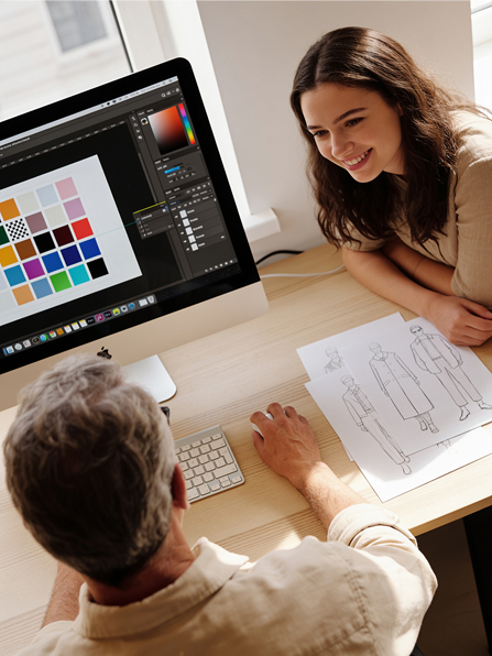 Designer reviewing colour palettes and fashion sketches with a client