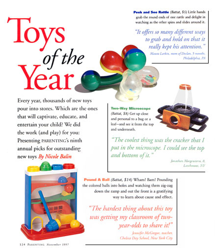 Magazine feature spread showing Toys of the Year picks with rattle, microscope and pound-a-ball toys